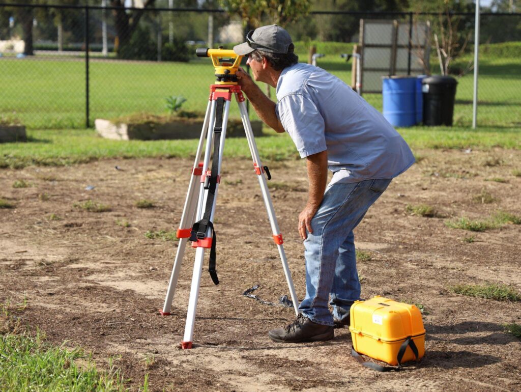 A licensed land surveyor at work.